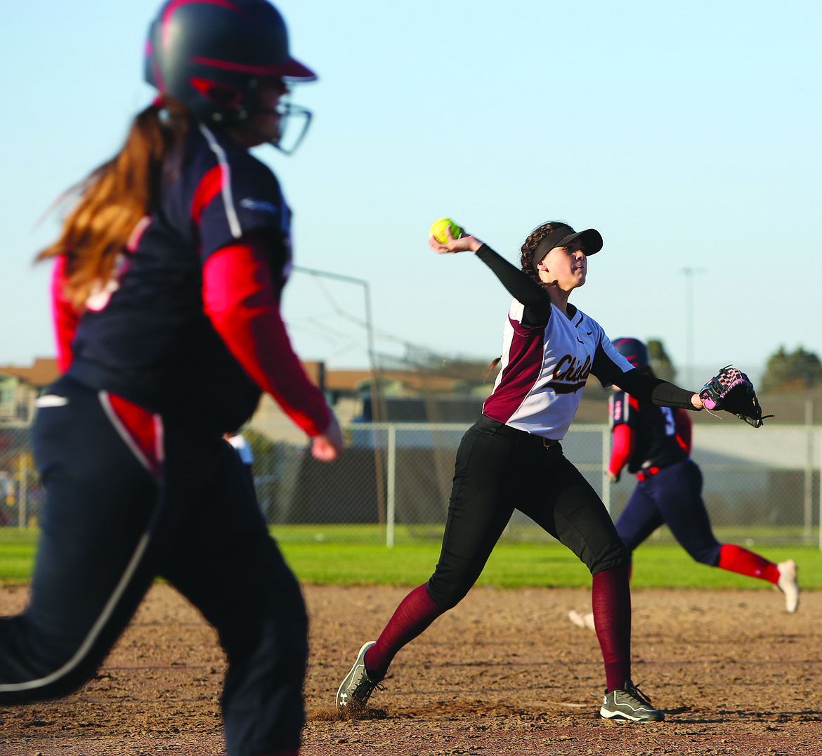 Connor Vanderweyst/Columbia Basin Herald
Moses Lake pitcher Victoria Hernandez throws to first base for an out against Eisenhower.