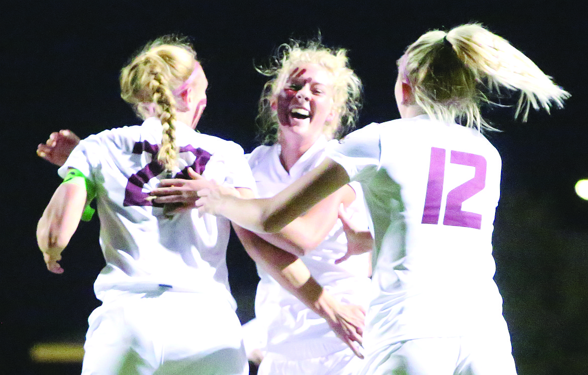 Connor Vanderweyst/Columbia Basin Herald
Abby Rathbun (22) and Morgan Skone (12) congratulate after Cora Bruneel scores in the first half.