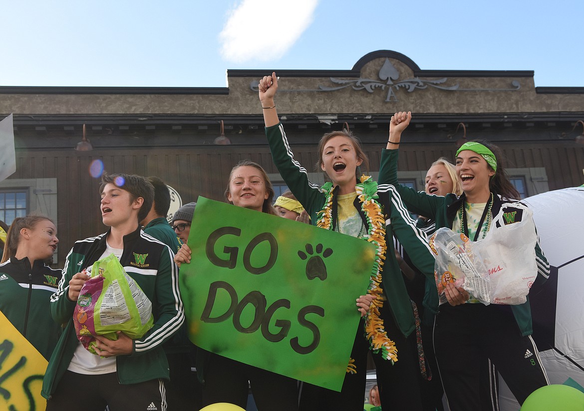 The Whitefish girls soccer team rides down Central Avenue during Friday&#146;s homecoming parade. (Daniel McKay/Whitefish Pilot)