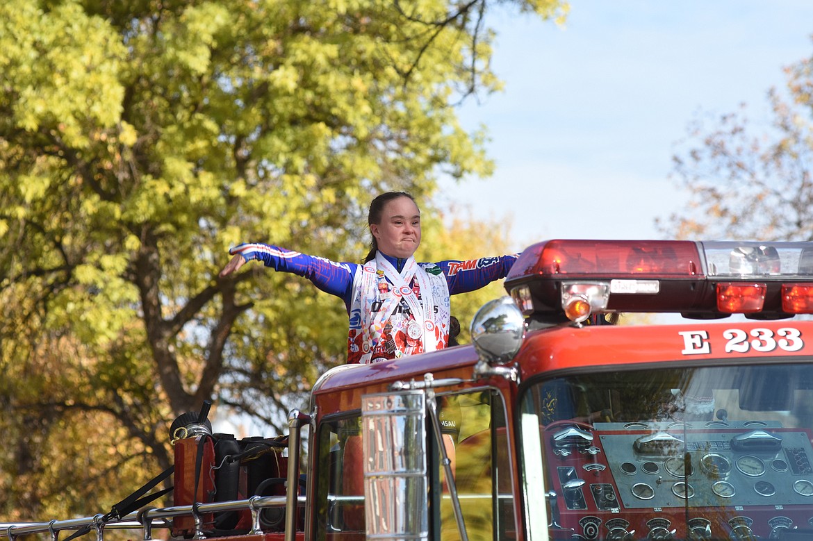 Dream Adaptive athlete Cedar Vance rides on a Whitefish fire truck during the homecoming parade on Friday. (Daniel McKay/Whitefish Pilot)