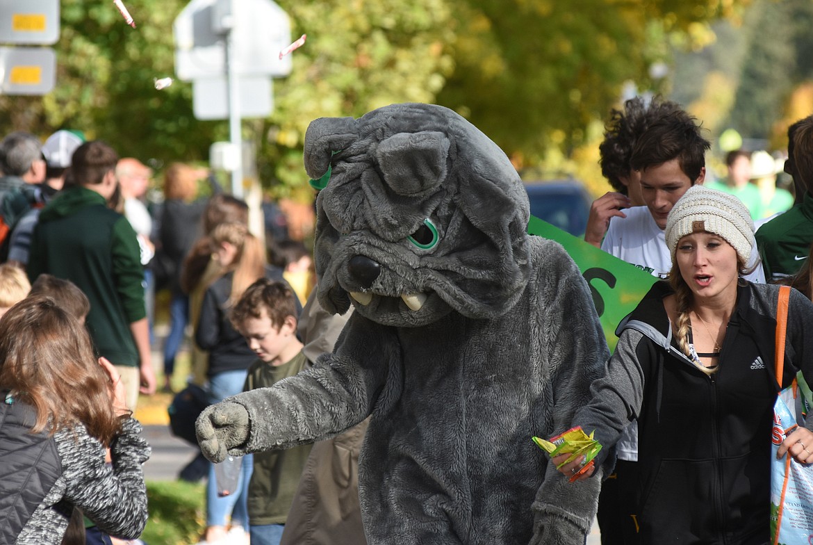 Kids received candy from the Whitefish Bulldog mascot during the homecoming parade on Friday. (Daniel McKay/Whitefish Pilot)