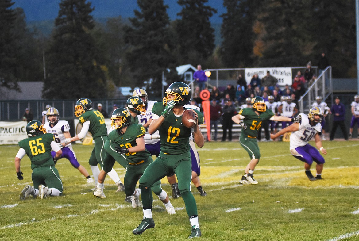 Forrest Kobelt drops back during the first quarter of Friday&#146;s homecoming loss to Polson. (Daniel McKay photos/Whitefish Pilot)