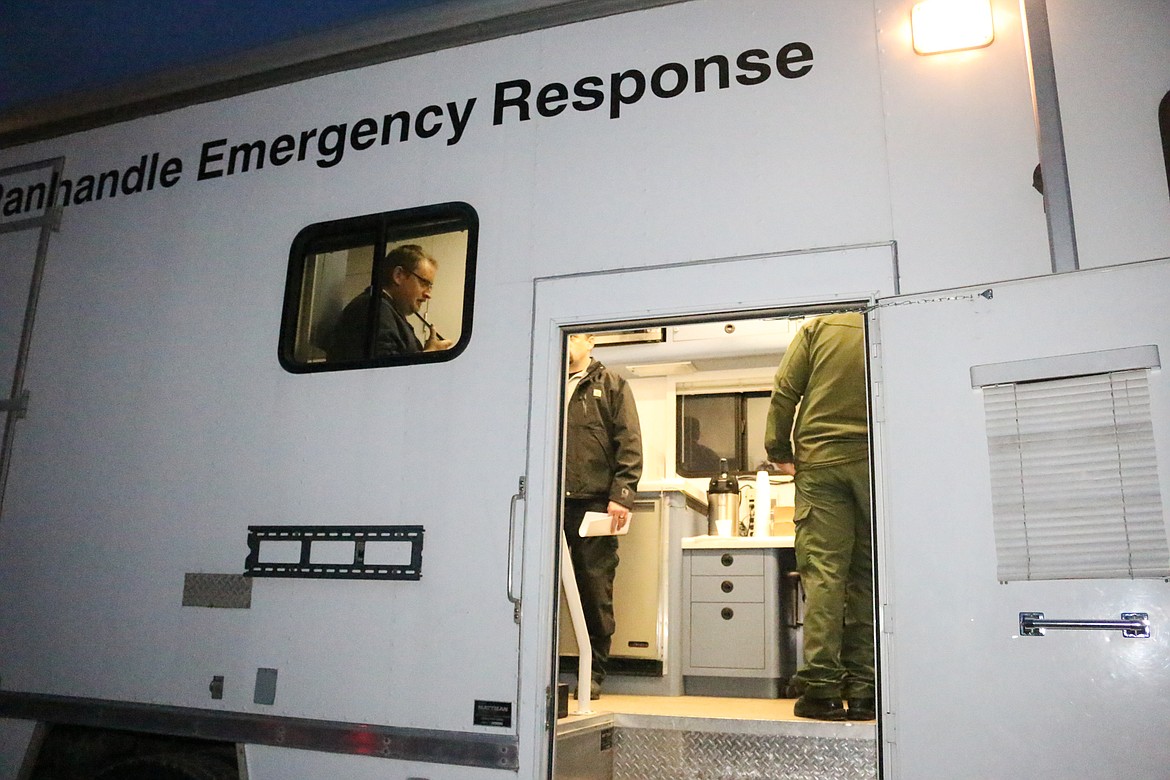 Photo by Mandi Bateman
North Bench Fire Chief Gus Jackson, the Incident Commander, is seen through the window of the Unified Command vehicle provided by Panhandle Health District.