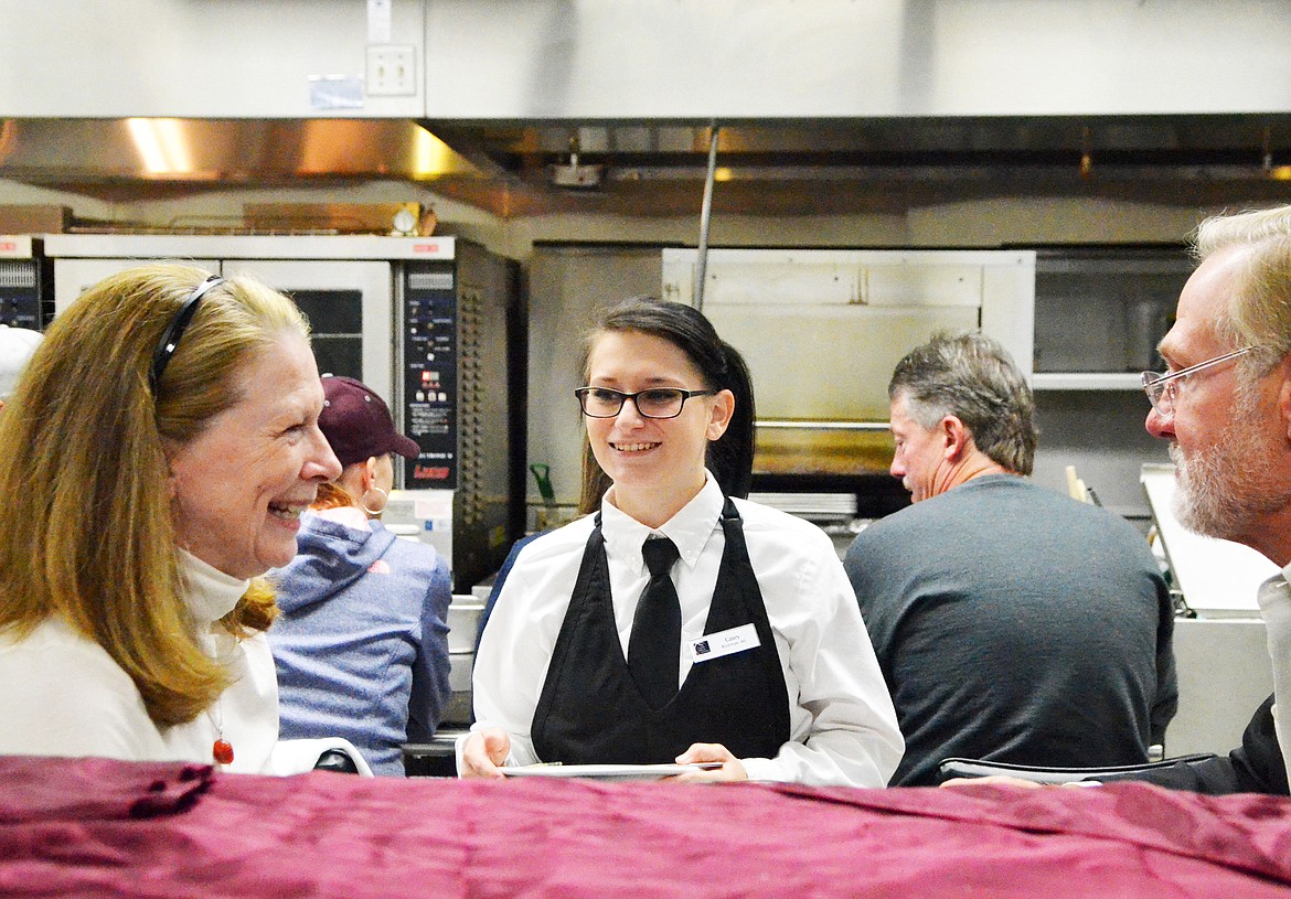 Culinary student Casey Pyskaty serves diners during a recent soft opening for one of the restaurants in the instructional kitchen at Flathead Valley Community College. (Heidi Desch/Whitefish Pilot)