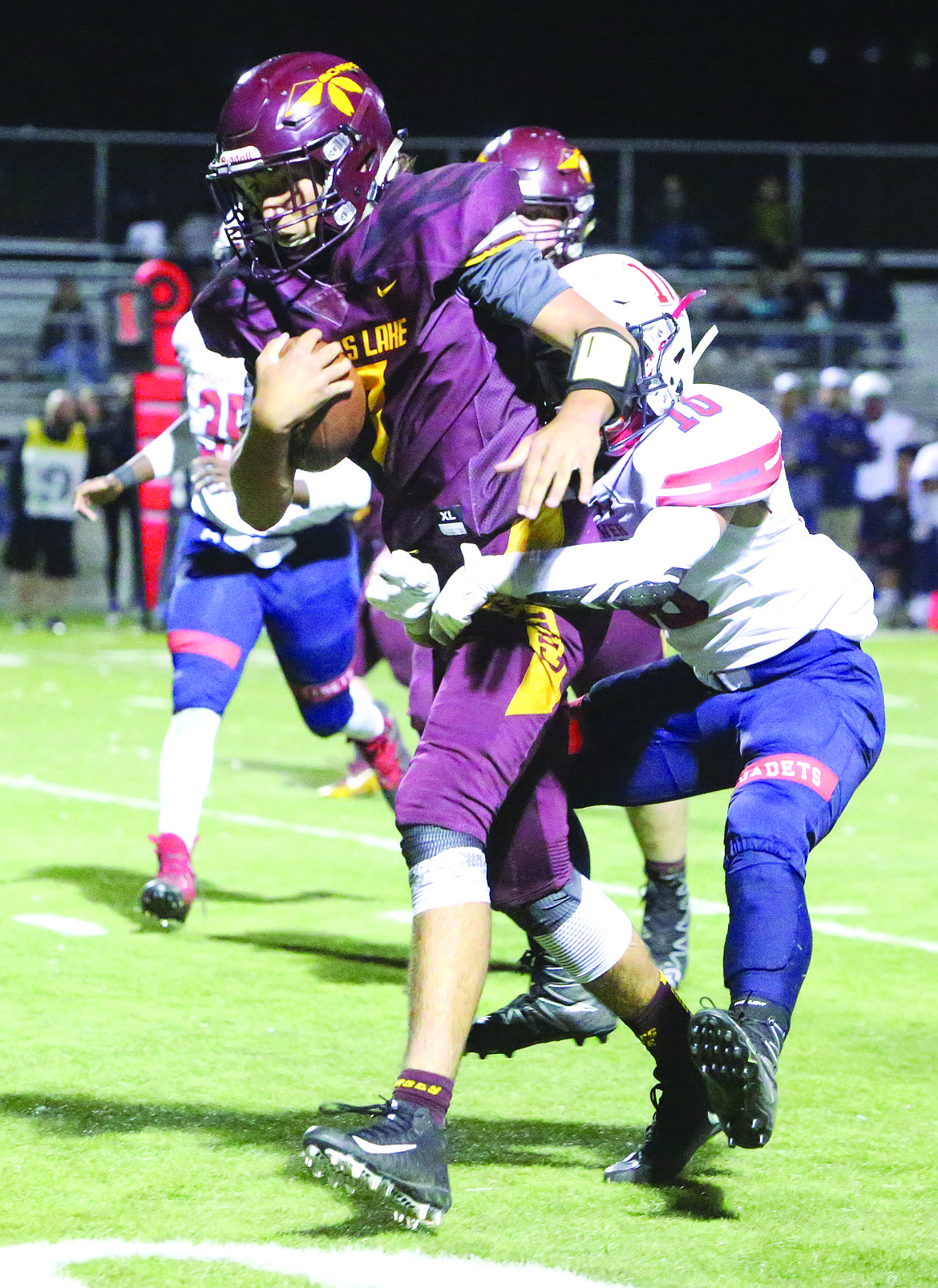 Connor Vanderweyst/Columbia Basin Herald
Moses Lake quarterback Dominic Signorelli scrambles for yards Friday against Eisenhower.