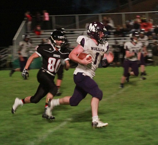 Mullan running back Skye Gallaway runs past a Lakeside defender during the Tigers&#146; loss to the Knights.