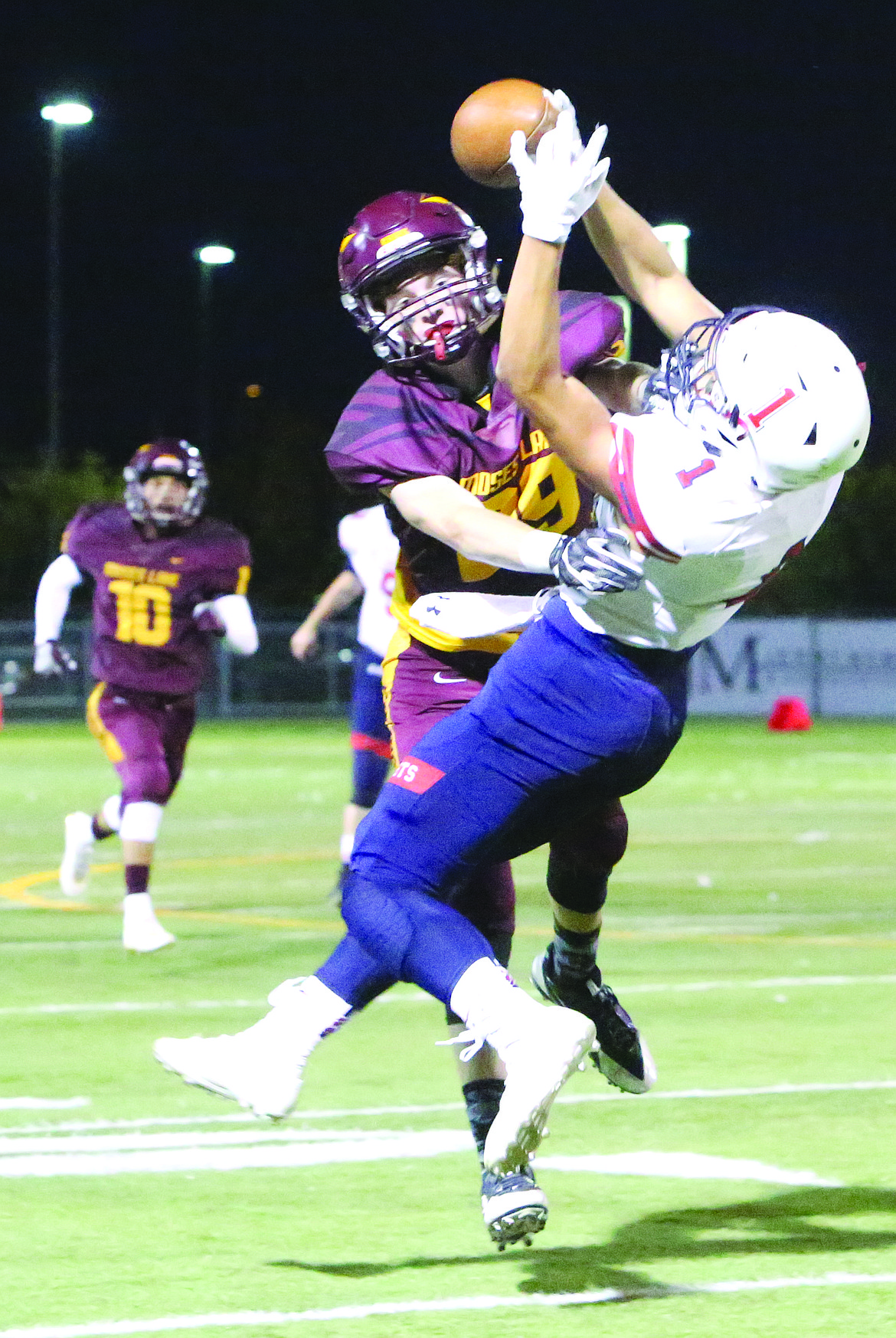 Connor Vanderweyst/Columbia Basin Herald
Moses Lake cornerback Blake Pugh breaks up a pass intended for Eisenhower receiver Drew Reyes.