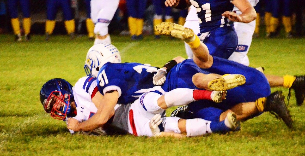 Thompson Falls&#146; Nate Thibeault (31) gets a sack to stop Bigfork at center field on Friday. (Erin Jusseaume/ Clark Fork Valley Press)