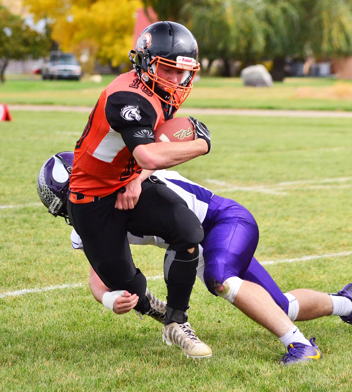 Tanner Orvitt runs through a Charlo tackle on Friday. (Erin Jusseaume/ Clark Fork Valley Press)