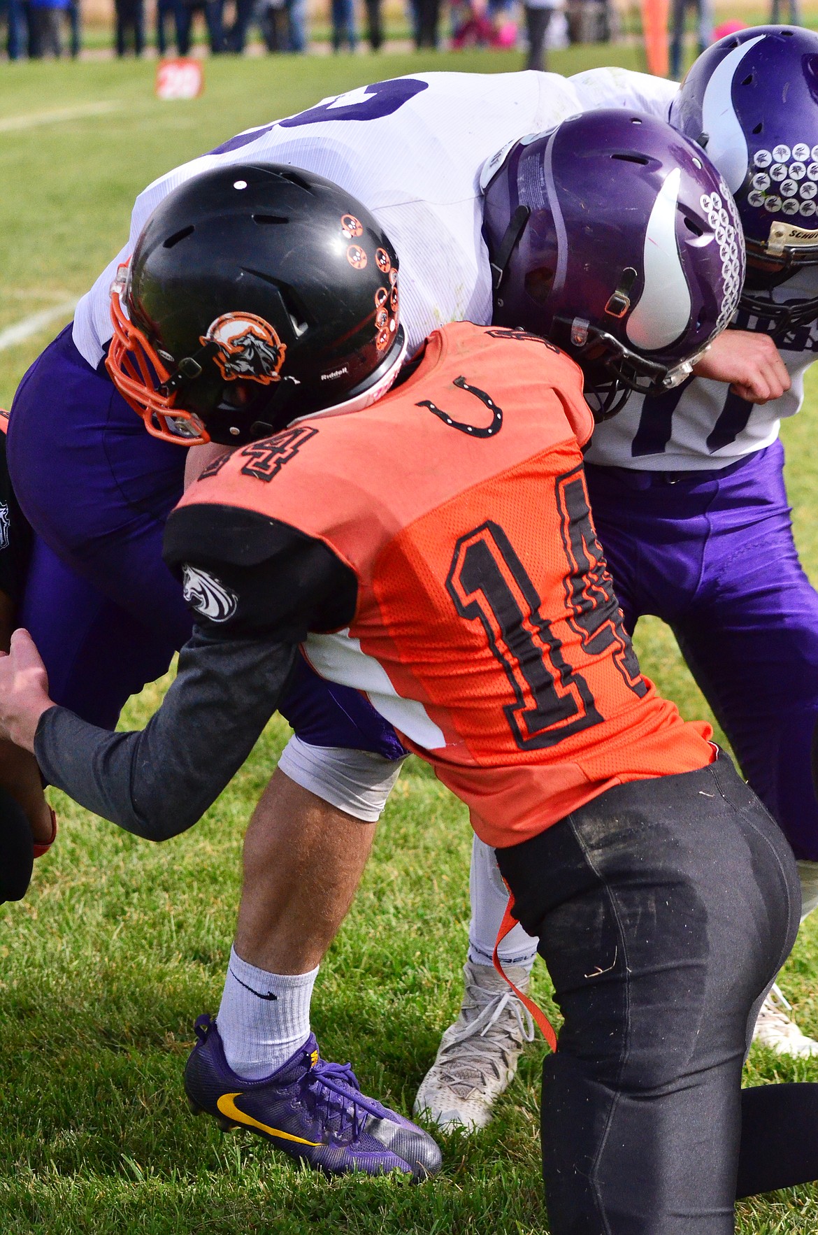 Kyle Weeks(14) gets a slid hit on the Vikings to stop the ball. (Erin Jusseaume/ Clark Fork Valley Press)