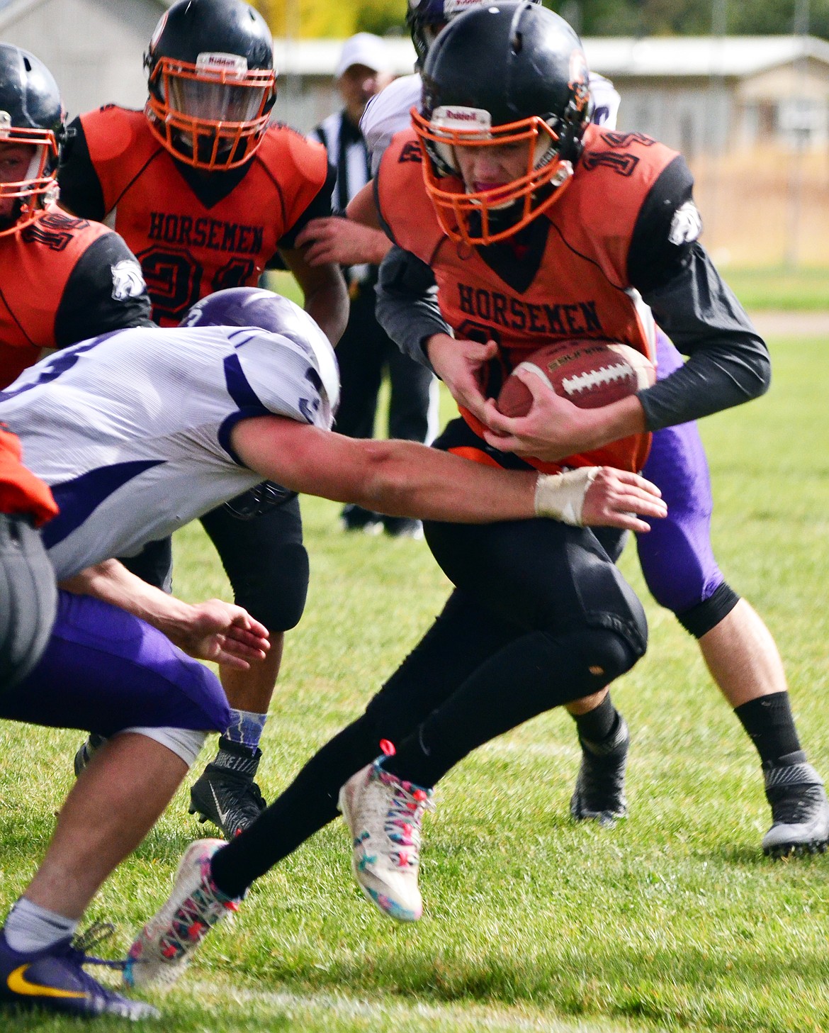 Kyle Weeks(14) uses quick feet to run o ut of a potential tackle to gain yards towards the endzone. (Erin Jusseaume/ Clark Fork Valley Press)