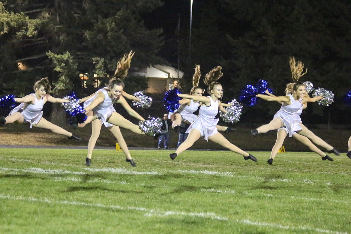 Photo by Mandi Bateman
The Badgerettes take to the air during the Homecoming game.