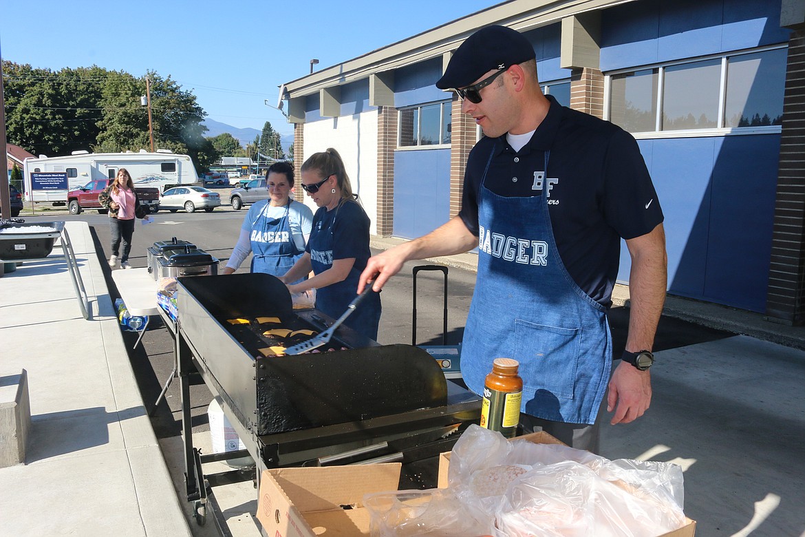 Mountain West Bank provided the food for the tailgate party as part of a fundraiser to help raise money for a safe and fun senior night for the students.