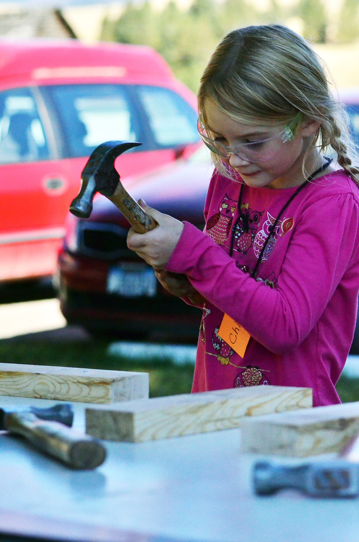 Miss Chloe learns what it takes to be a contract worker during kindergarten career day at Plains School on Friday. (Erin Jusseaume photos/Clark Fork Valley Press)