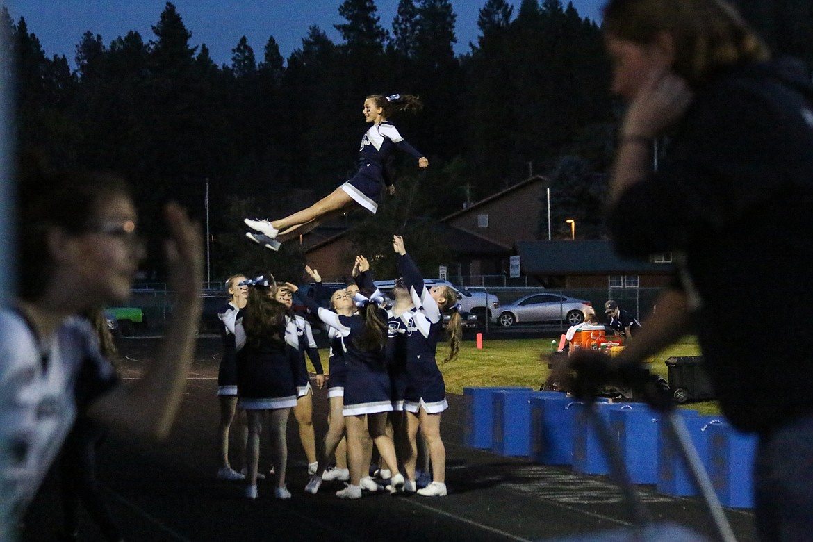 Photo by Mandi Bateman
Ayla Worley stunting during warm-up at the Homecoming football game.