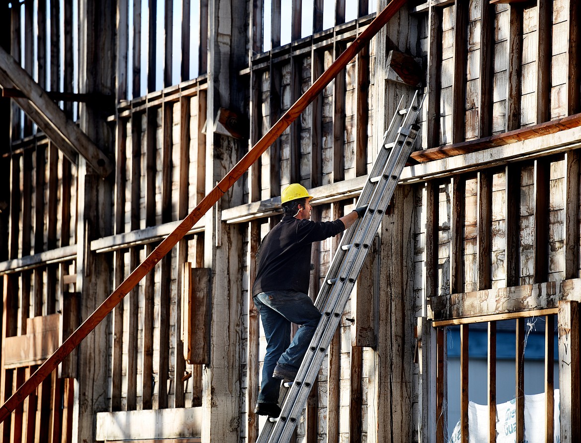 Gary Delp, owner of Heritage Timber LLC of Missoula, works on the deconstruction of the Kalispell Lumber Company building on September 20 in Kalispell.(Brenda Ahearn/Daily Inter Lake)