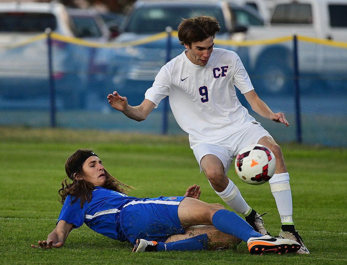 Tristan Grein (8) gets slide tackled in the first half.