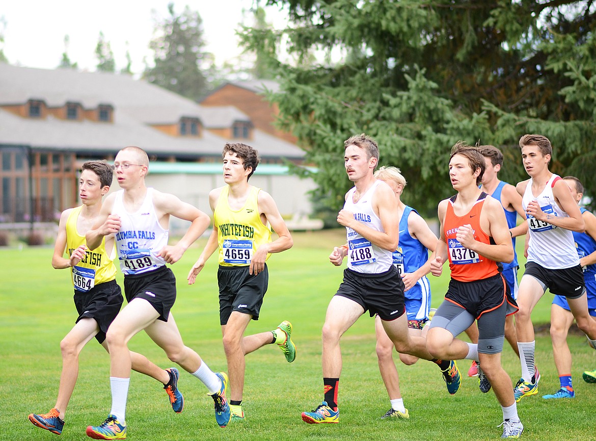 Miles Vrentas and Bridger Gaertner fight for the front of the pack during the varsity boys race at the Whitefish Invite last Tuesday. (Daniel McKay/Whitefish Pilot)