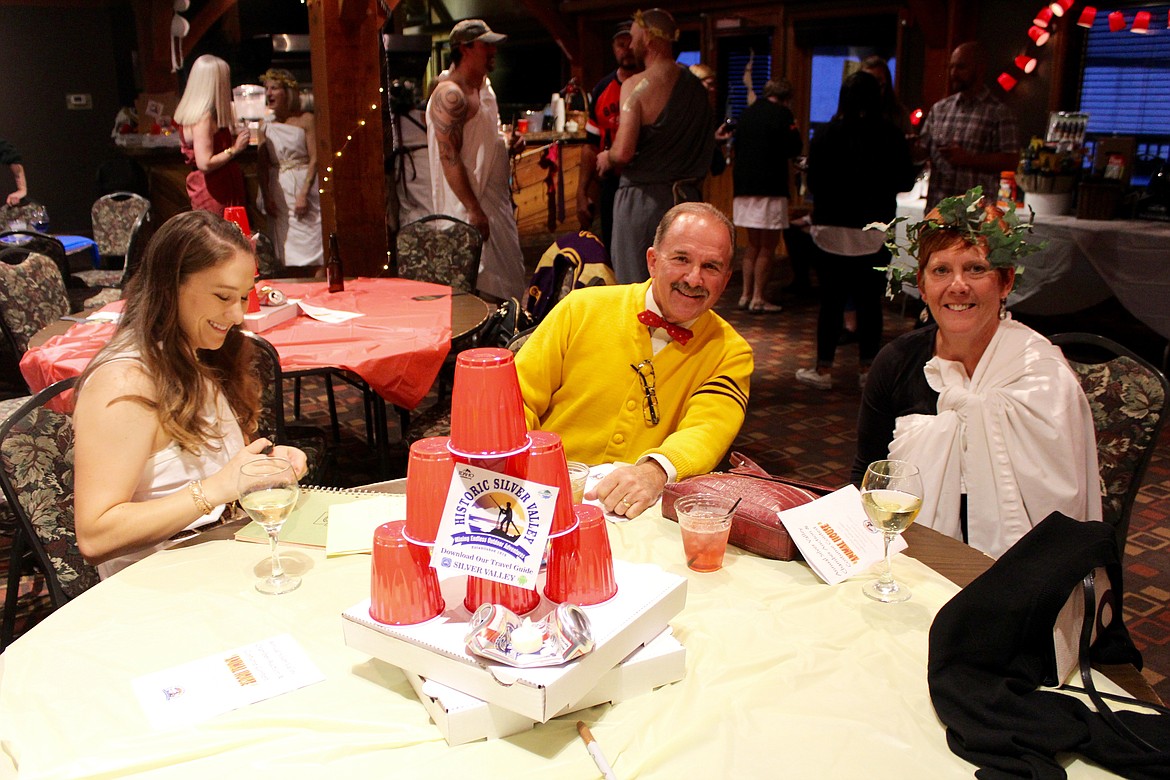 Mary Rehnborg sells some raffle tickets to Orland Berti and Janice Berti.