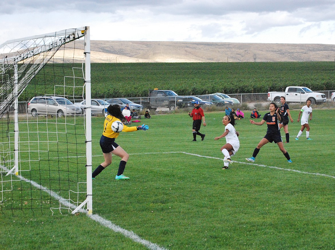 Bob Kirkpatrick/The Sun Tribune - Junior striker Celeste Lopez rockets this shot past the Hawks keeper in second half action to put the Warriors up 3-0.