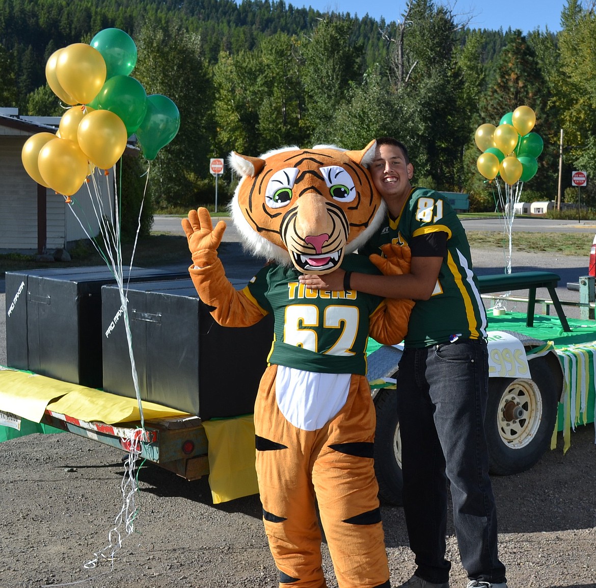 St. Regis tiger mascot with student, Josh Drobny as they get ready for the Homecoming Parade on Friday. (Photo by Art Drobny).