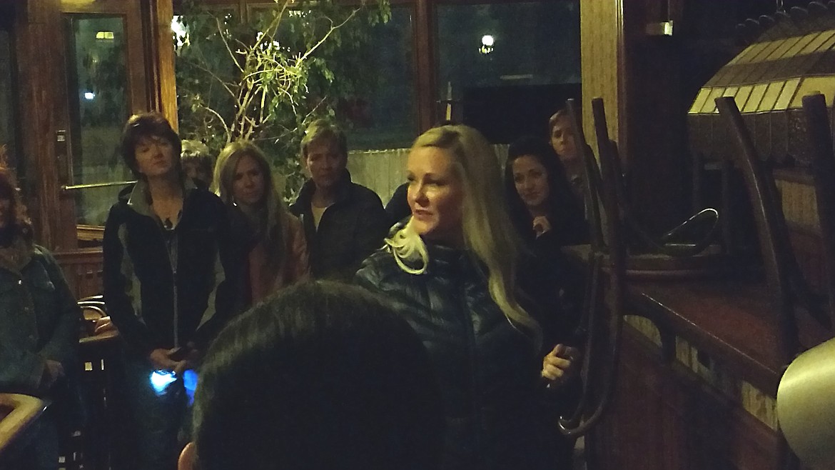 DEVIN HEILMAN/Press
Psychic medium Jennifer Von Behren, center answers questions from curious tour-goers during an informal paranormal investigation of the historic Jameson Hotel in Wallace on Sept. 23. About 25 ladies toured the Jameson and Ryan hotels to try to capture evidence and communicate with the other side.