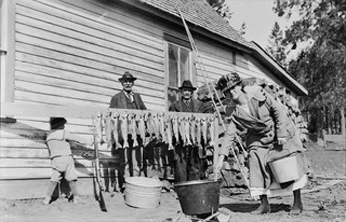 Photograph of Frank Weed and other family members with a big catch of trout, most likely beside the Weeds &#147;Fisherman&#146;s Home Restaurant&#148; in Bigfork.
Date circa late 1920s 
Attribution: Bigfork Art &amp; Cultural Center