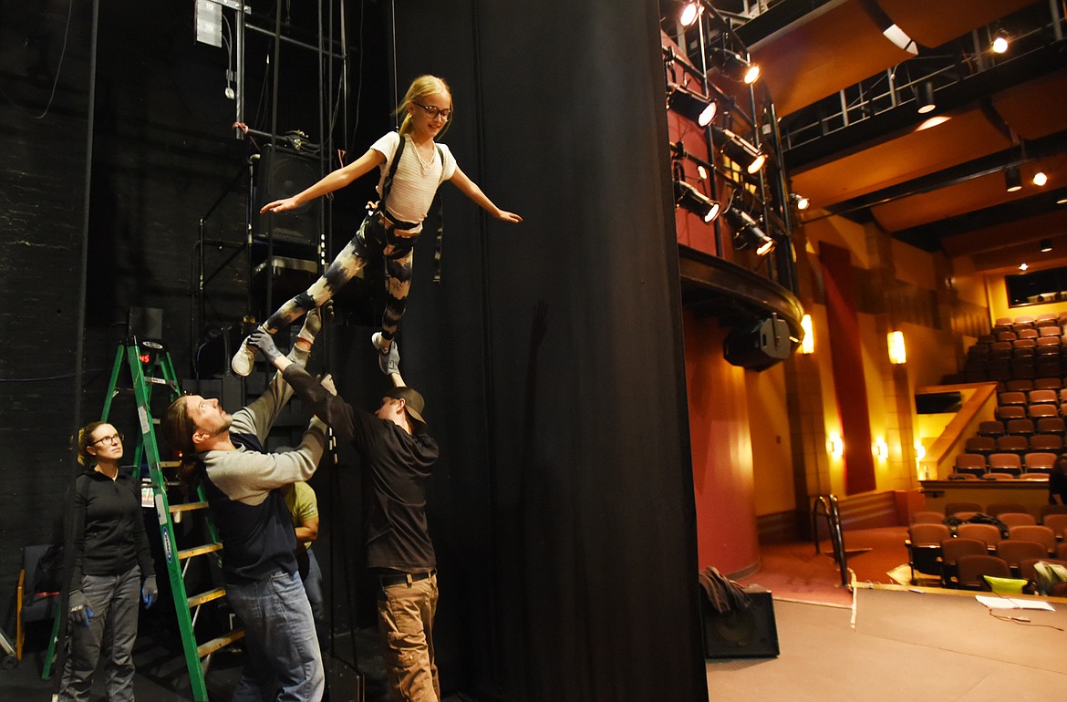 Selah Hagler, 12, prepares to fly across the stage as they rehearse the leopard fight scene.
(Brenda Ahearn/This Week in the Flathead)