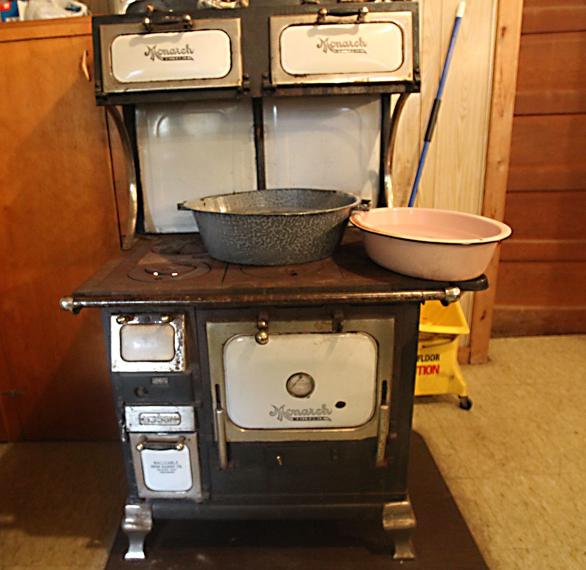 DEVIN HEILMAN
Flames in this neat antique Monarch Walltable stove kept pans of water heated Saturday for volunteers who worked the Cowboy Breakfast at Pleasantview School in Post Falls. The school, built in 1910, still maintains original flooring, walls, water heaters and other relics from its heyday.