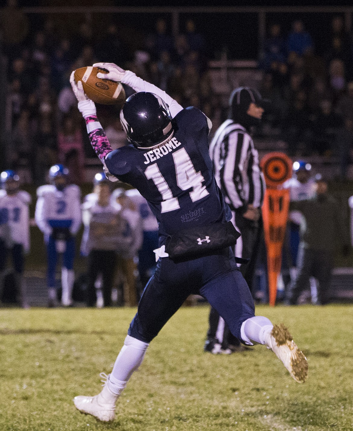 LOREN BENOIT/PressLake City wide receiver Travis Jerome catches a pass over the middle against Coeur d'Alene.