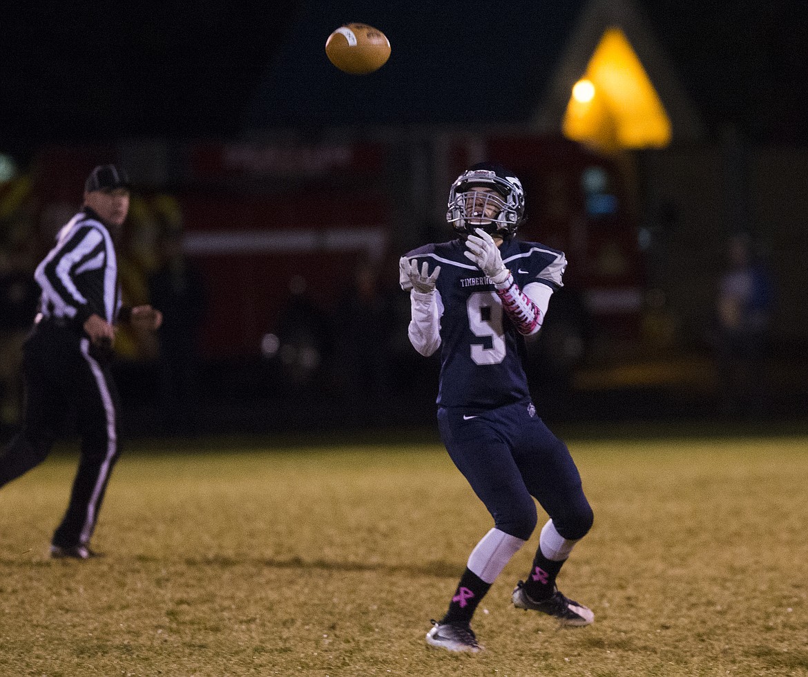 LOREN BENOIT/PressLake City wide receiver Nick Felix catches a deep pass against Coeur d'Alene during Friday night's game at Lake City High School.