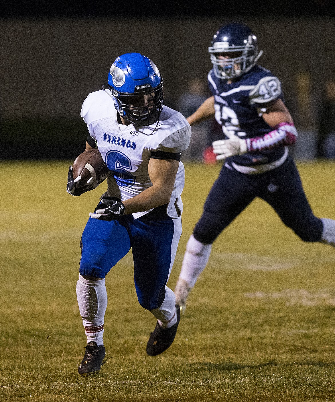 LOREN BENOIT/PressCoeur d'Alene running back Shilo Morgan rushes the ball against Lake City during Friday night's game.