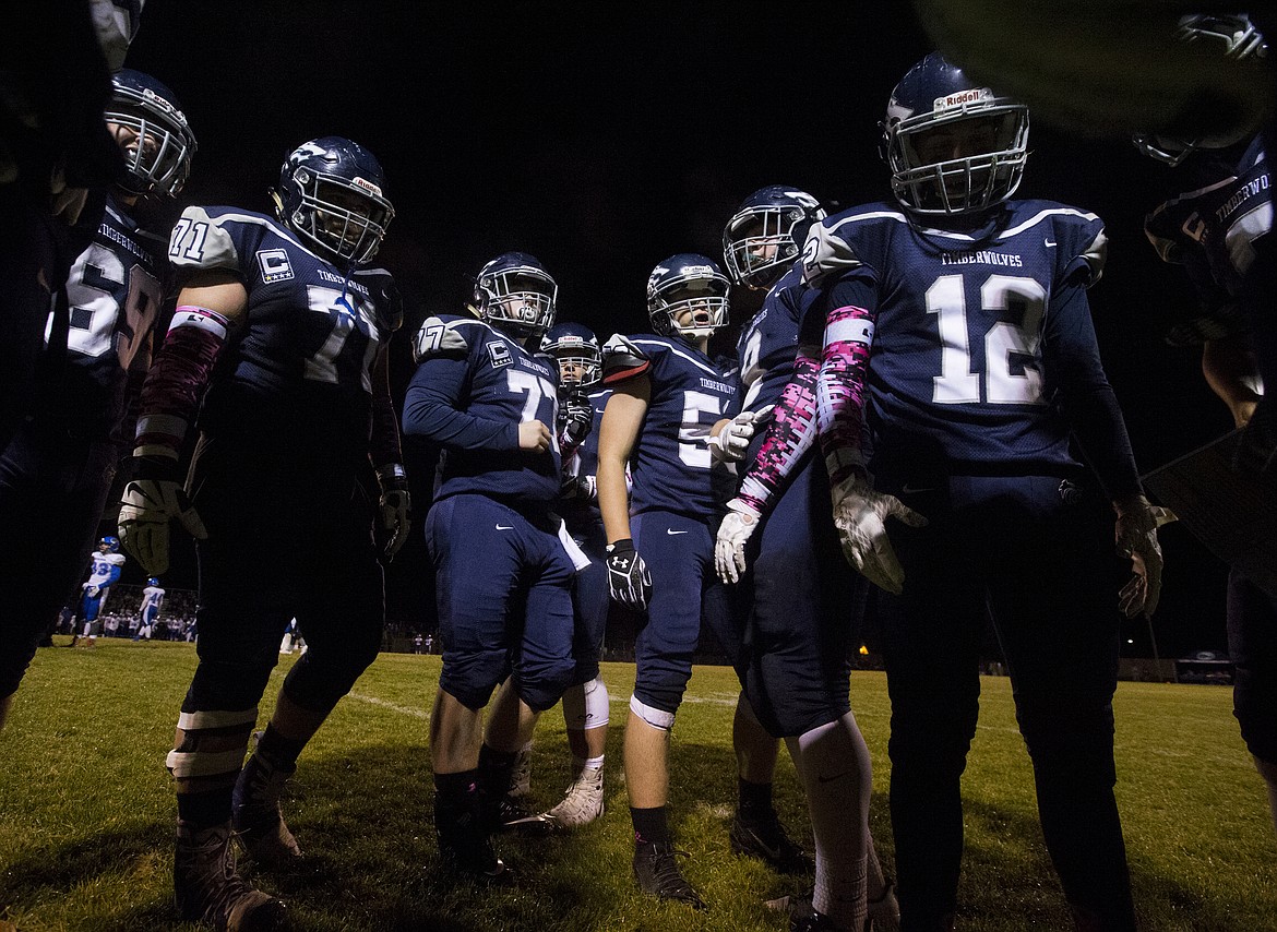 LOREN BENOIT/PressLake City's offense huddles up before taking the field for a possession during Friday night's game against Coeur d'Alene.