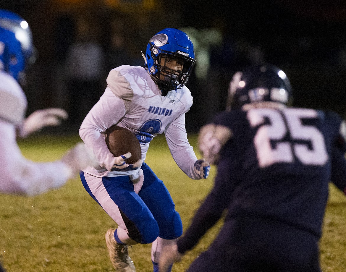 LOREN BENOIT/PressCoeur d'Alene wide receiver Kaden Hagel runs the ball against Lake City.