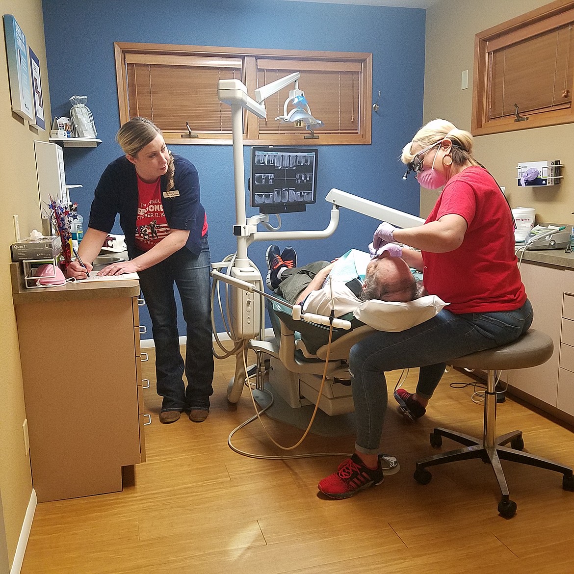 HOLLY PASZCZYNSKA/Press
Lindsay Von Beheren (left) and Jay Langston (right) perform free dental services to a local veteran on Tuesday for Freedom Day USA 2017 at Advanced Family Dentistry in Coeur d&#146;Alene.