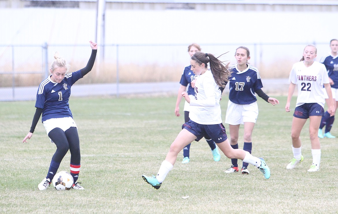 JASON ELLIOTT/Press
Timberlake forward Erica Vanderhoof attempts to clear the ball past Coeur d&#146;Alene Charter defender Marissa Hagerty during the first half of Thursday&#146;s 3A District 1-2 girls championship match at Sunrise Rotary Soccer Fields in Rathdrum.