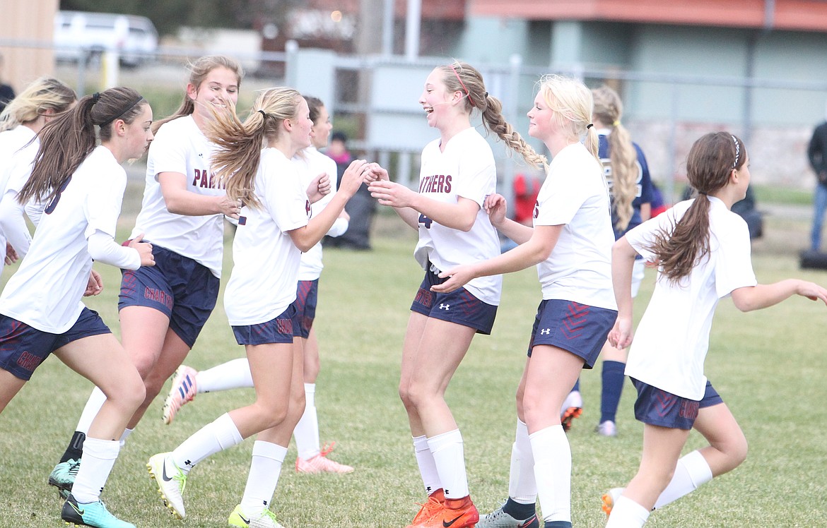 JASON ELLIOTT/Press
Coeur d&#146;Alene Charter midfielder Sandy Faulkner, middle, congratulates Sarah Hines after a first-half goal in the 3A District 1-2 girls soccer championship game at Sunrise Rotary Fields in Rathdrum.