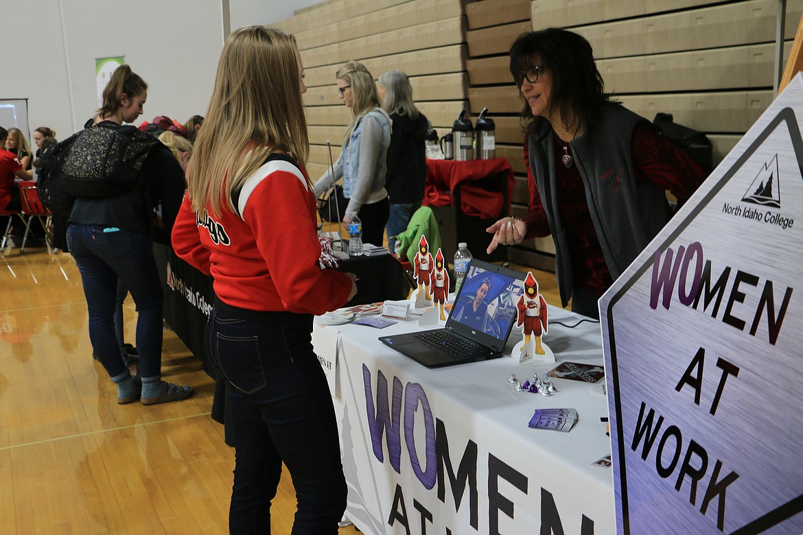 (Photo by MARY MALONE)
Sandpoint High School sophomore Rachawna Garner discusses possible future careers with representatives from North Idaho College Friday during the NIC Career-Technical Education Roadshow Roadshow at SHS.