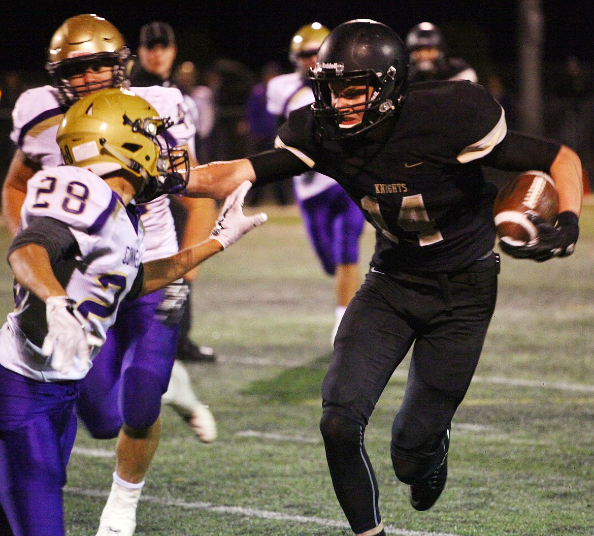 Rodney Harwood/Columbia Basin HeraldRoyal wide receiver (14) Corbin Christensen extends his run-after-catch during the second quarter if Friday's SCAC East game with Connell.