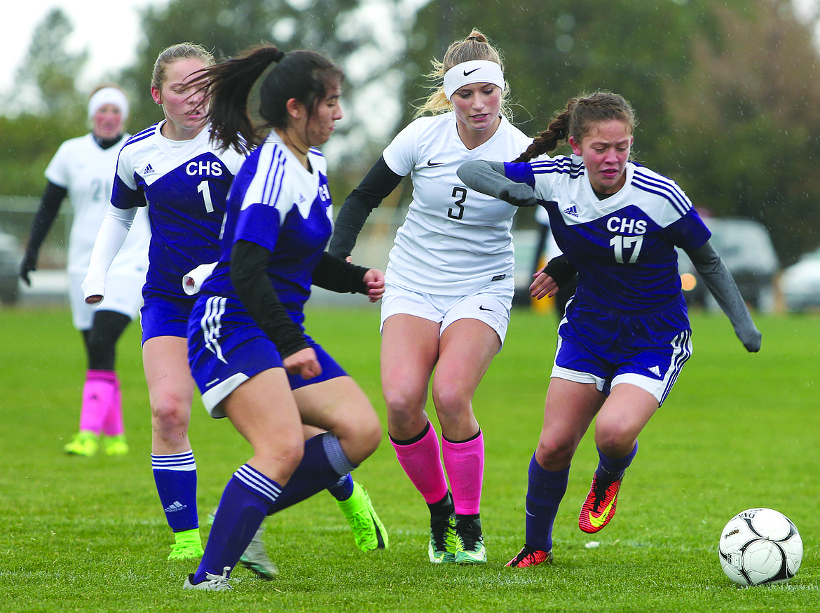 Connor Vanderweyst/Columbia Basin Herald
Warden forward Aubree Skone (3) tries to get to the ball between Connell defenders.