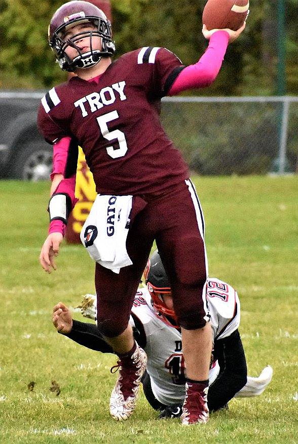 Troy&#146;s Cody Osterberg gets off a pass as Darby&#146;s Dylan Schlapman tries to take him down Saturday, Oct. 14.