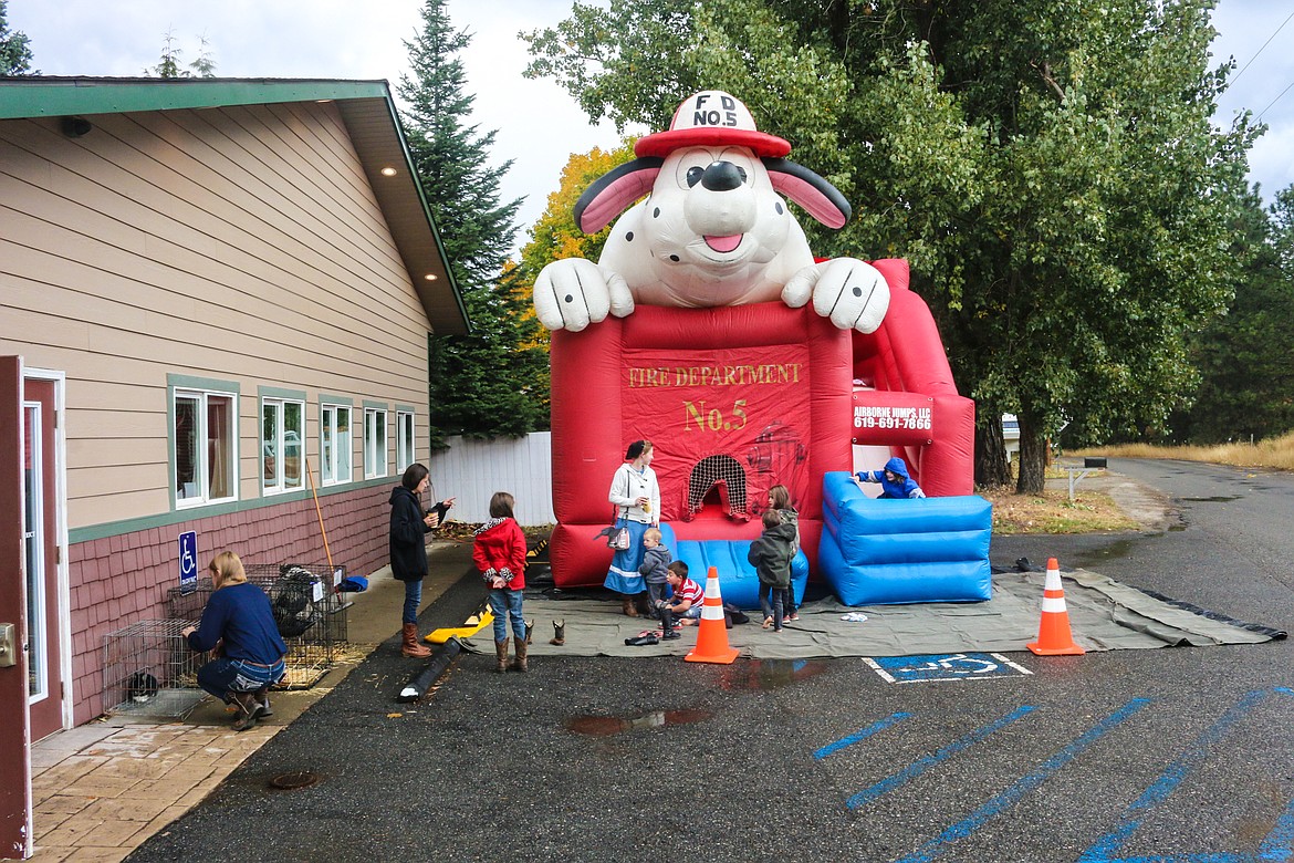 Photo by Mandi Bateman
The Bouncy House outside of the Naples fire station kept the kids happy despite the occasional rain.