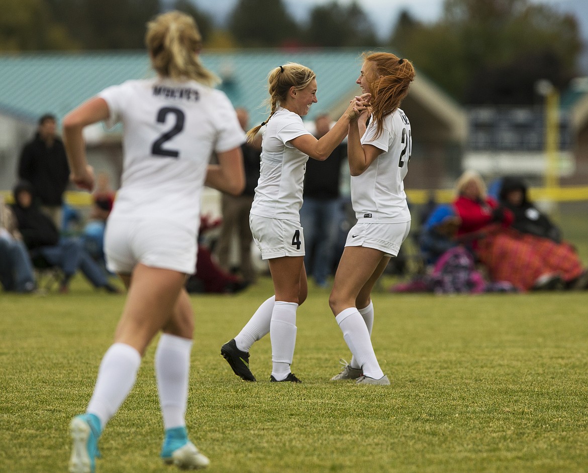 Lake City&#146;s Chloe Teets (4) celebrates her goal against Post Falls with Payton Barber in the 5A Region 1 championship game on Tuesday at Lake City High School. 
LOREN BENOIT/Press