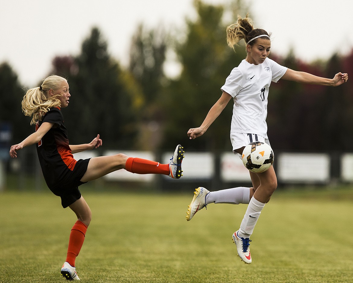 LOREN BENOIT/Press

Lake City&#146;s Lexi Medina, right, deflects Bridget Rieken&#146;s pass during the 5A Region 1 Championship game on Tuesday at Lake City High School.