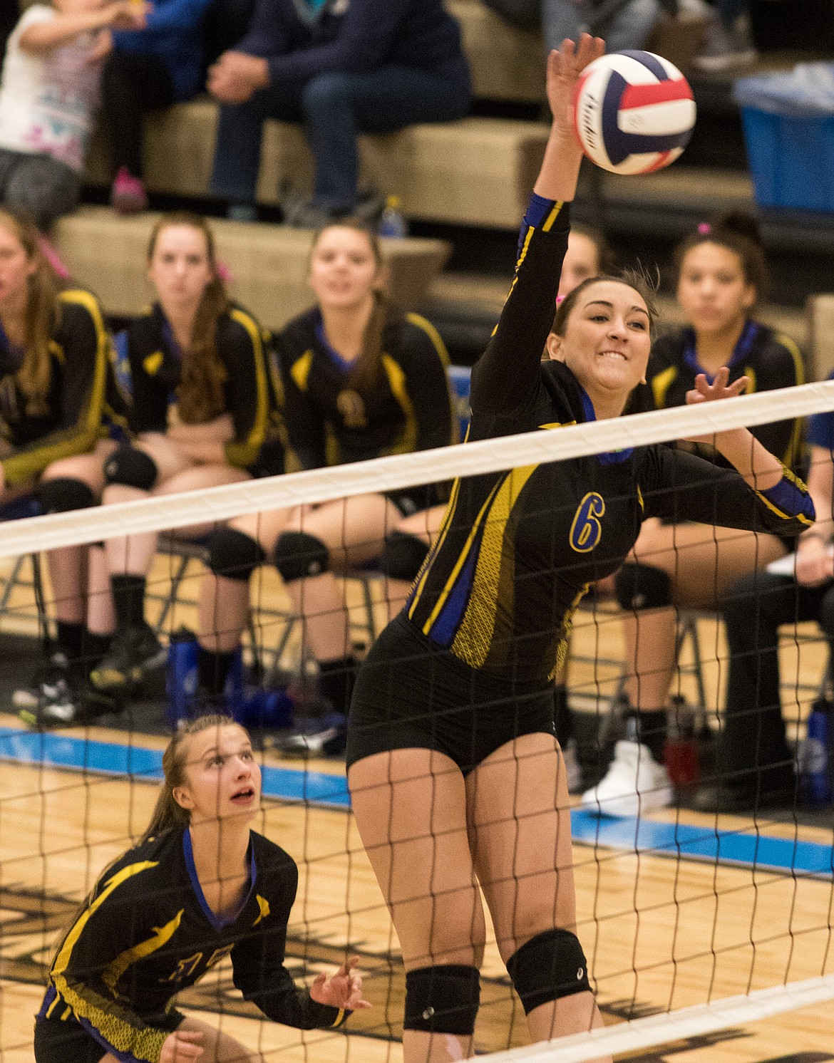 Libby&#146;s Brooklyn Rainer goes for a kill against Ronan in Libby Saturday, Oct. 14.