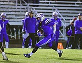 Wildcats rack up the yards in rout of rival Bulldogs, 56-7