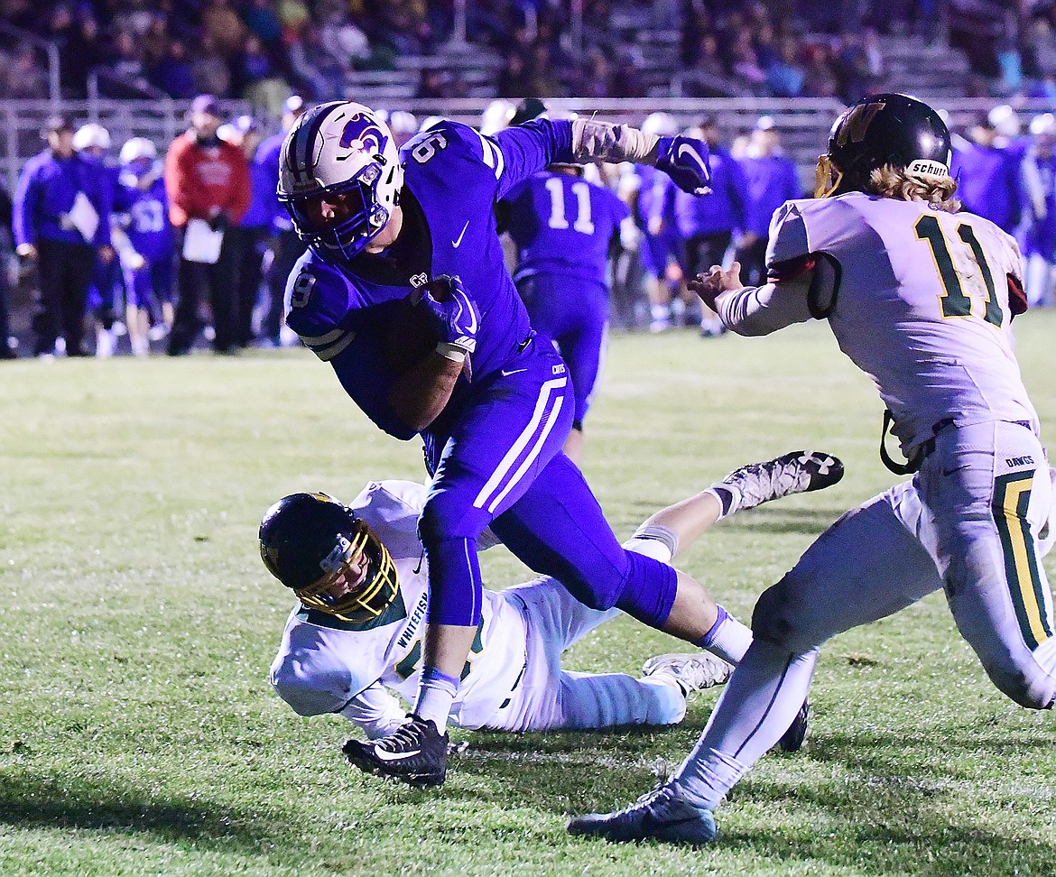 Logan Kolodejchuk blasts into the end zone against Whitefish last week.