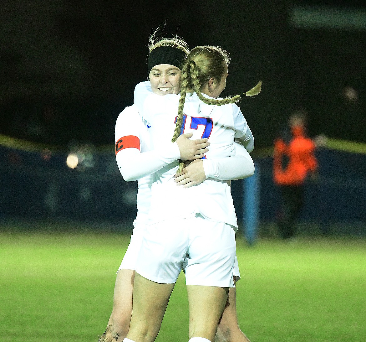 Hannah Callendar gets a hug from Joyce Hatfield (17) after scoring a goal in the second half.