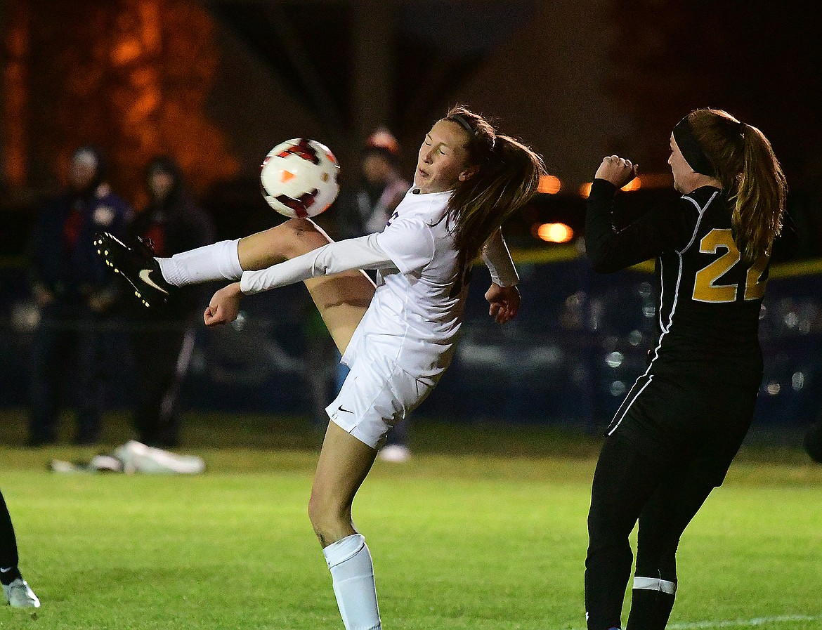 Josie Windauer deflects a ball.