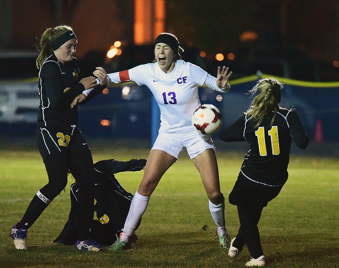 Hannah Gedlaman gets sandwiched by three Stevi defenders.